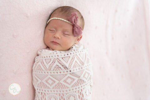 Photo from a newborn portrait session taken by Cumming GA newborn photographer.