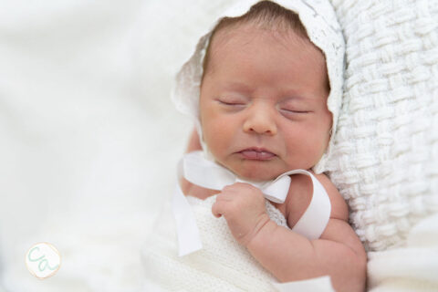 Photo from a newborn portrait session taken by Cumming GA newborn photographer.